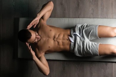 A man doing situps after testosterone replacement therapy in Jacksonville